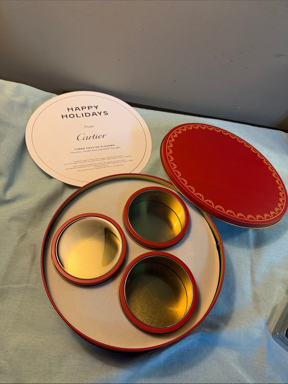 Cartier Red and Gold Round Holiday Tin Set